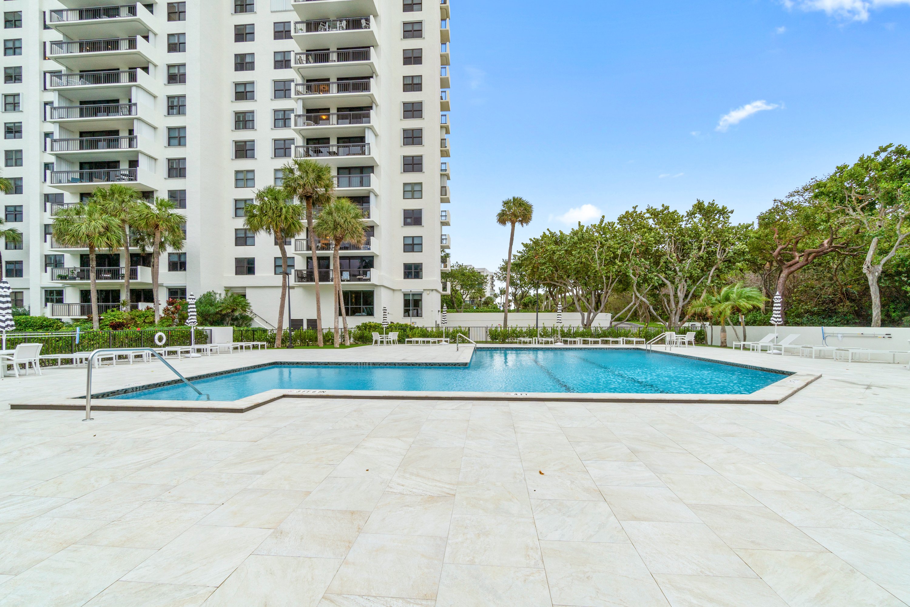 2003 North Ocean Boulevard, Unit 305 Boca Raton, FL 33431 - Photo 55 of 56 a view of a swimming pool with a yard