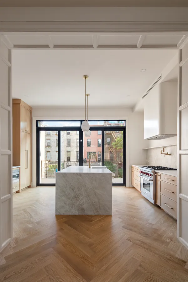 a kitchen with stainless steel appliances granite countertop a stove and a sink