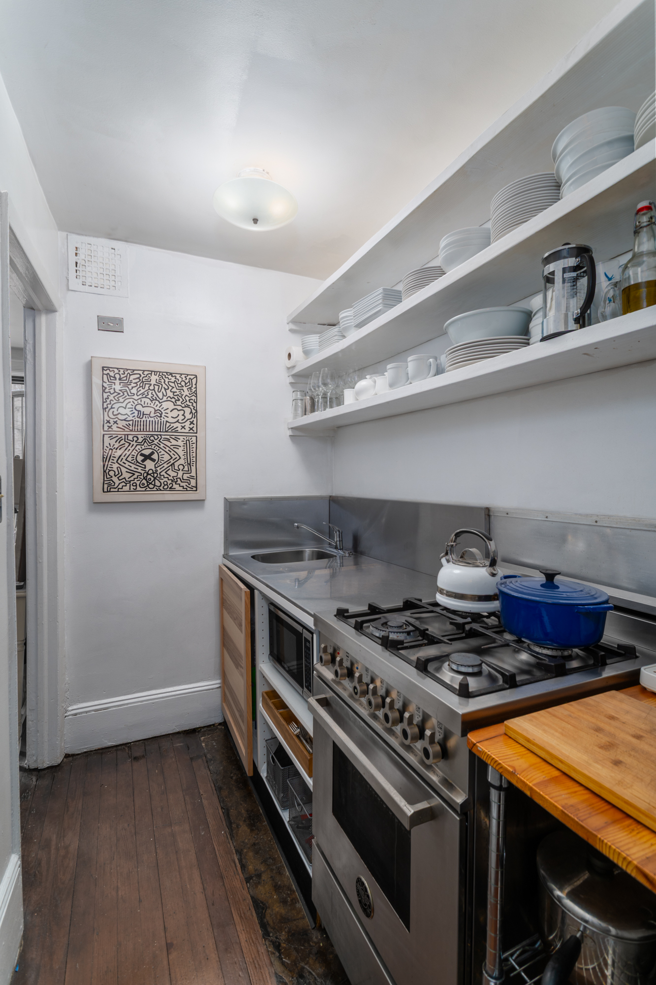 426 West 160th Street Manhattan, NY 10032 - Photo 28 of 33 a stove top oven sitting inside of a kitchen