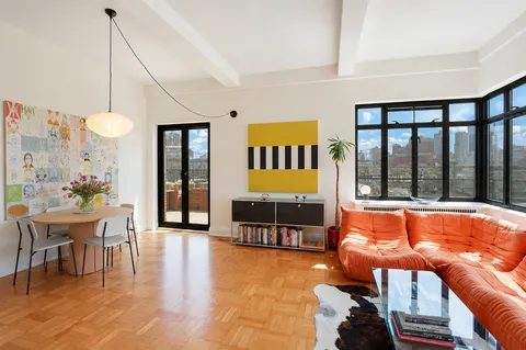 a dining room with furniture and window