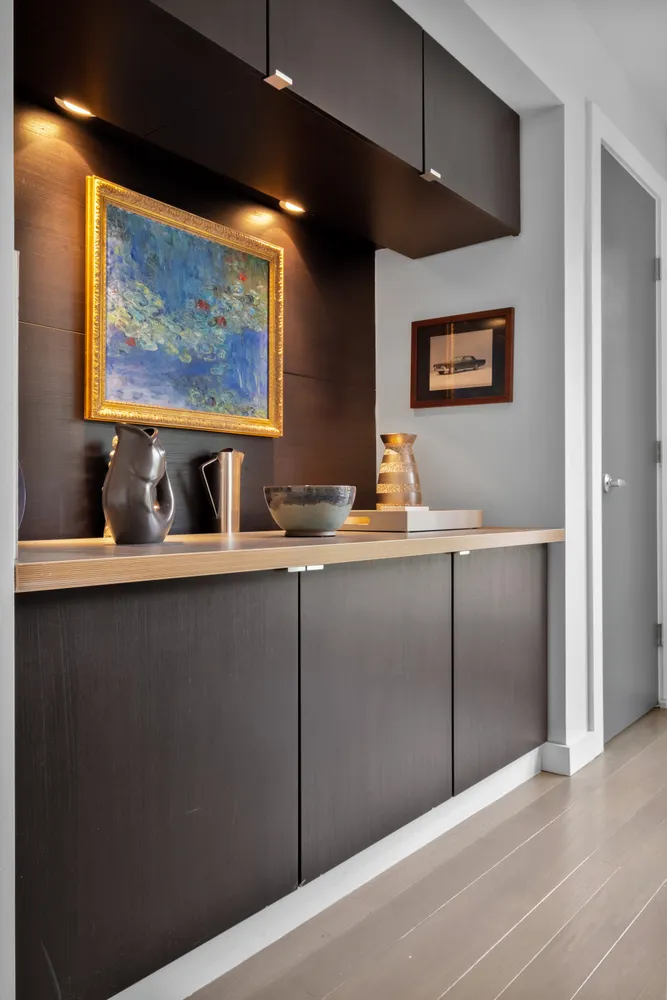 a bedroom with a bed and a lamp