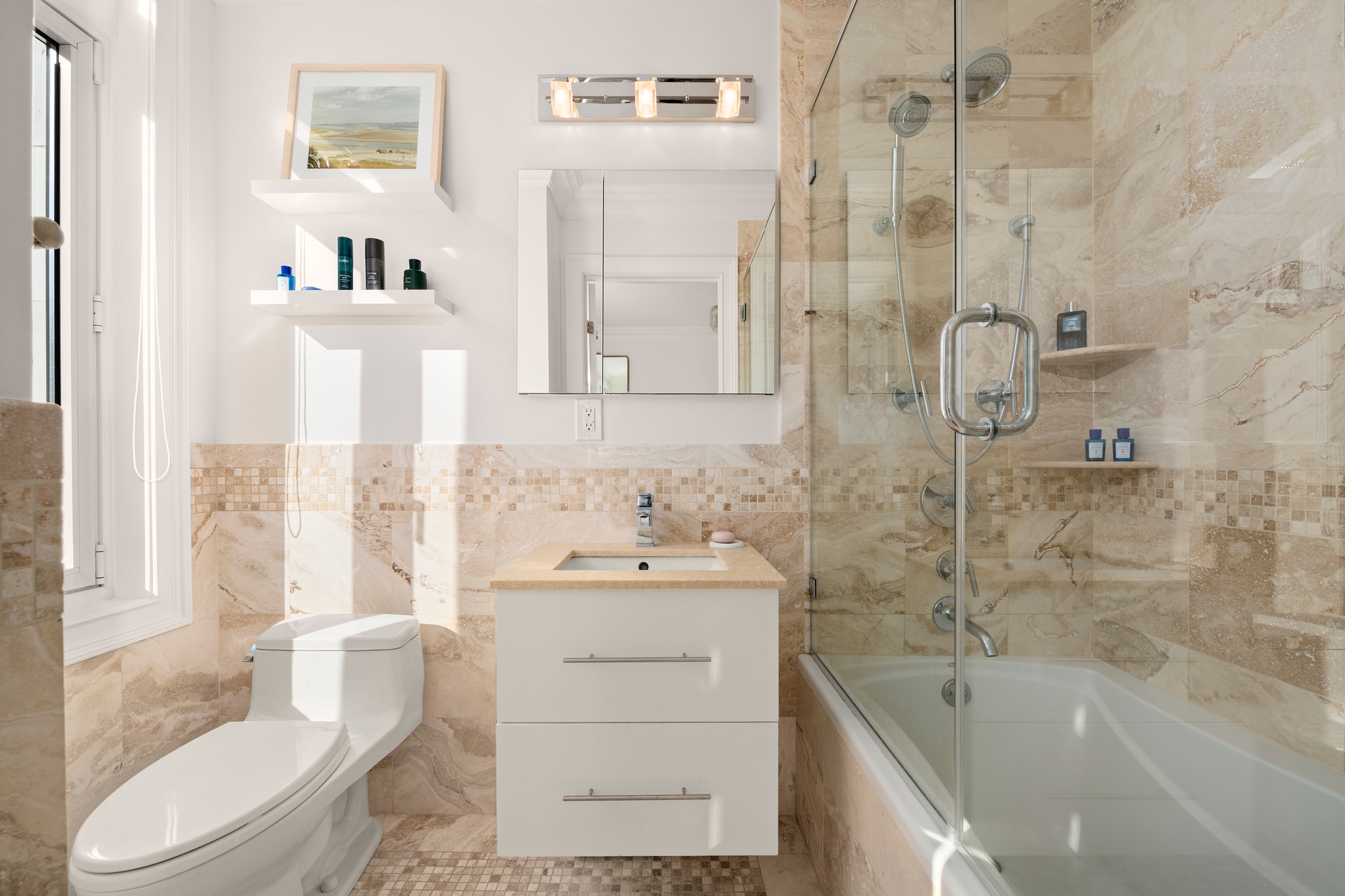 305 West 72nd Street, Unit 10A Manhattan, NY 10023 - Photo 7 of 12 a bathroom with a sink toilet vanity and shower