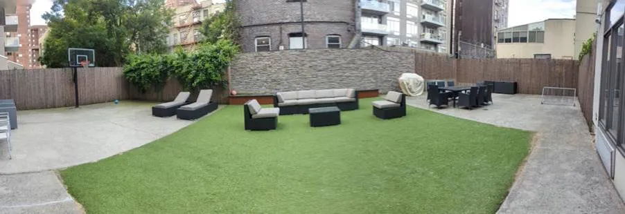 a view of a patio with couches and potted plants