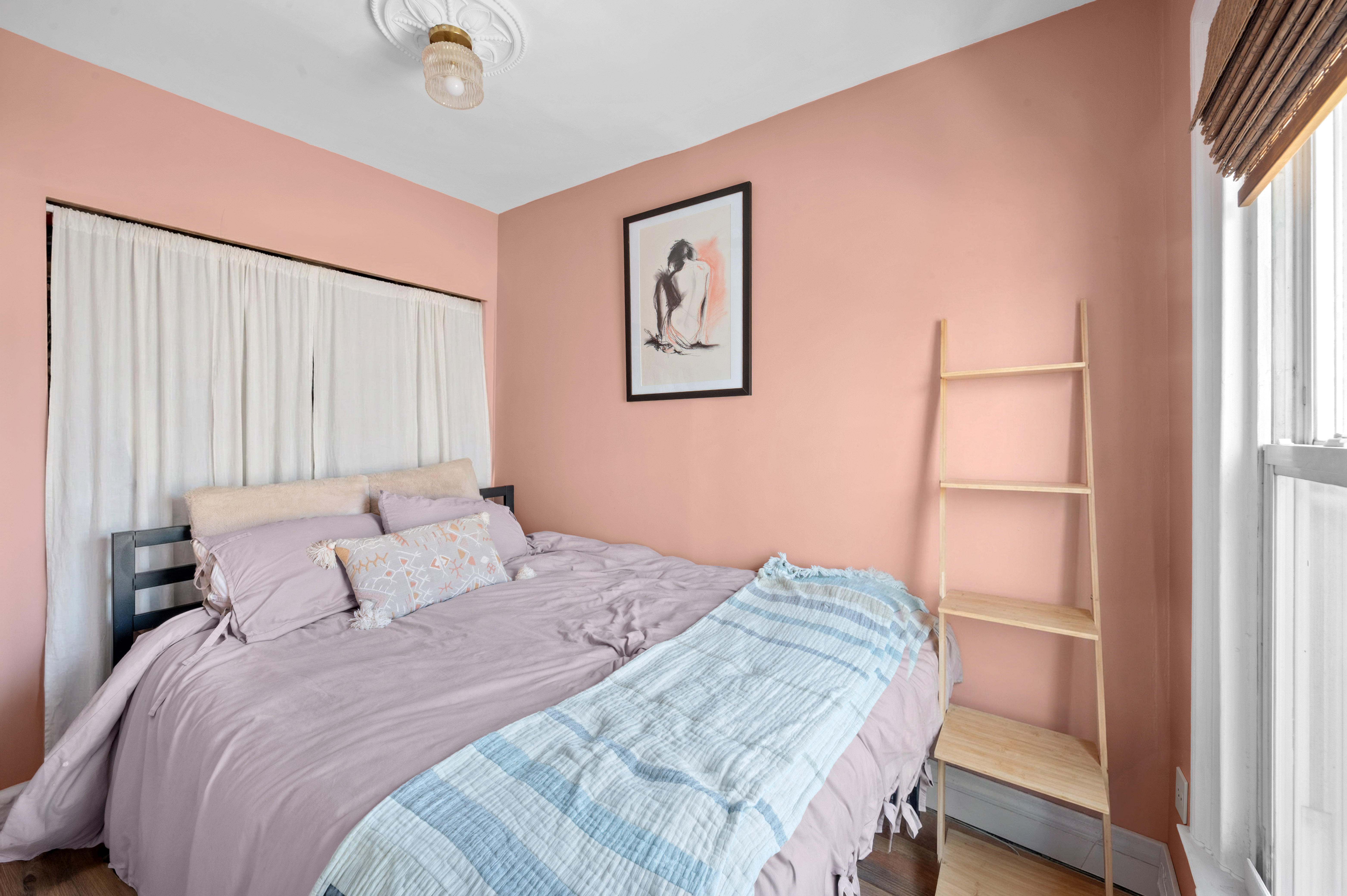 204 Madison Street, Unit 3 Brooklyn, NY 11216 - Photo 3 of 5 a bedroom with a bed and a window