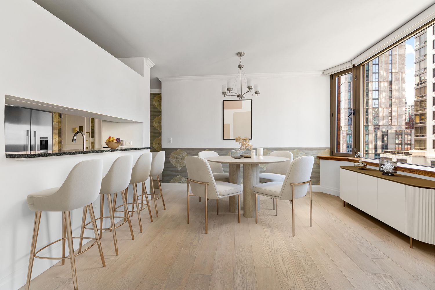 a view of a dining room with furniture and window