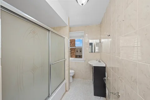 a bathroom with a shower and a toilet