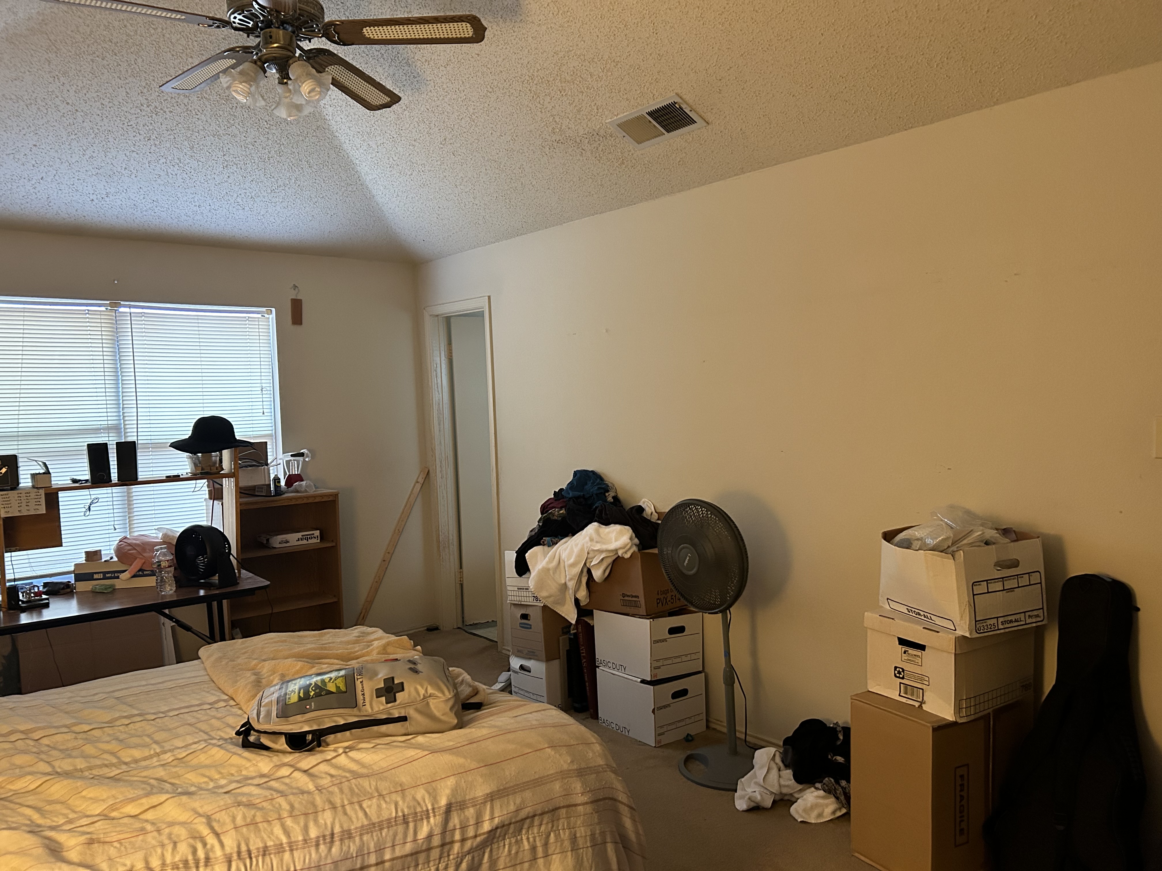 408 Rose Drive Allen, TX 75002 - Photo 8 of 11 a bedroom with a bed and cabinets