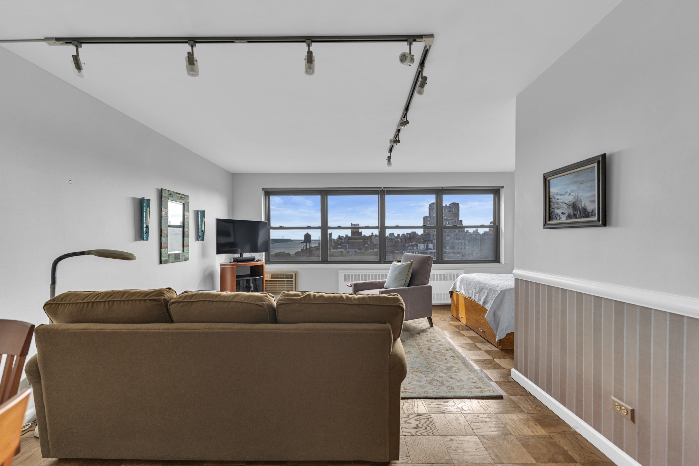 a living room with furniture and a window