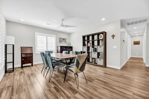 a view of a dining room with furniture and wooden floor