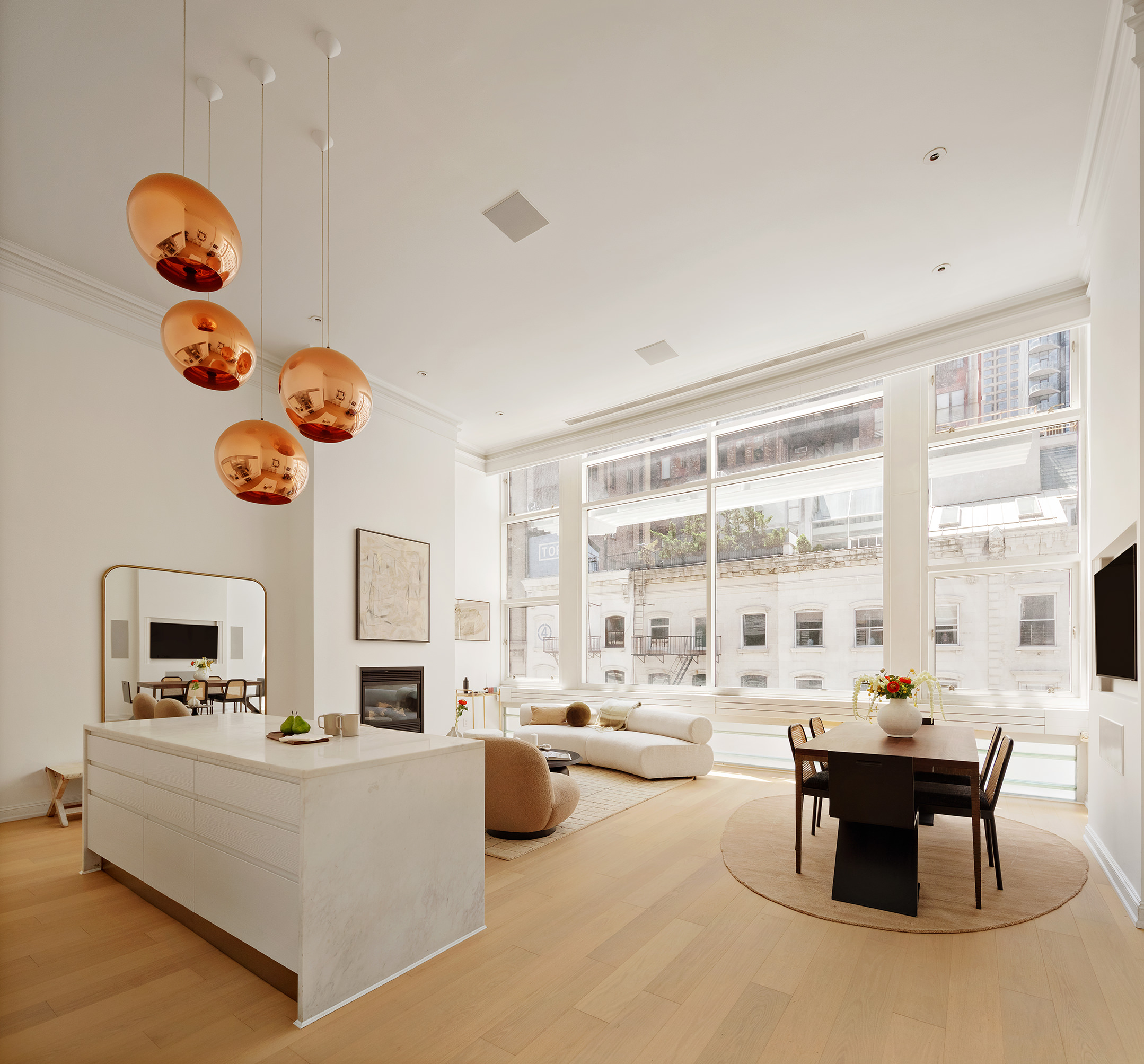 16 Warren Street, Unit 5 Manhattan, NY 10007 - Photo 2 of 18 a living room with fireplace furniture and a large window