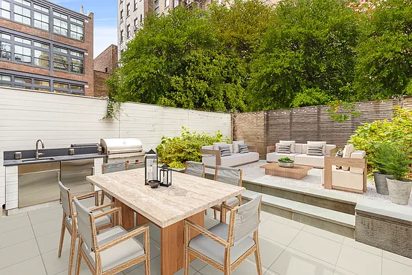 215 Sullivan Street, Unit THC Manhattan, NY 10012 - Photo 4 of 16 a view of a patio with table and chairs and potted plants