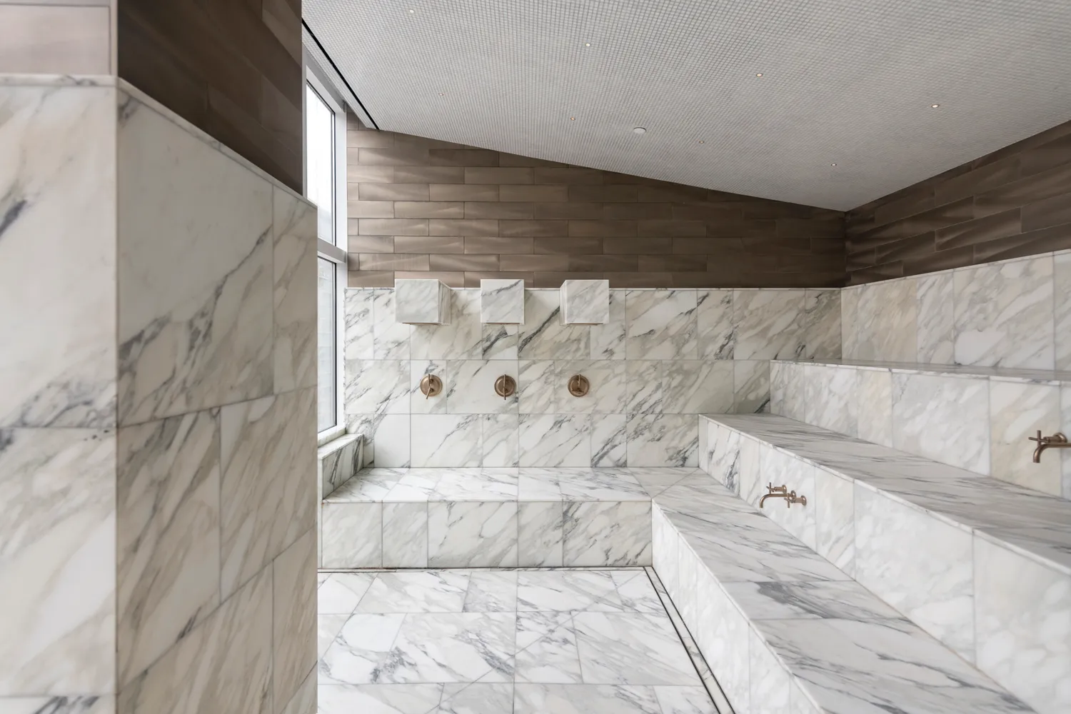 a bathroom with a bathtub and shower