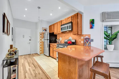 a kitchen with a table and chairs in it