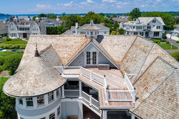 an aerial view of residential houses with outdoor space