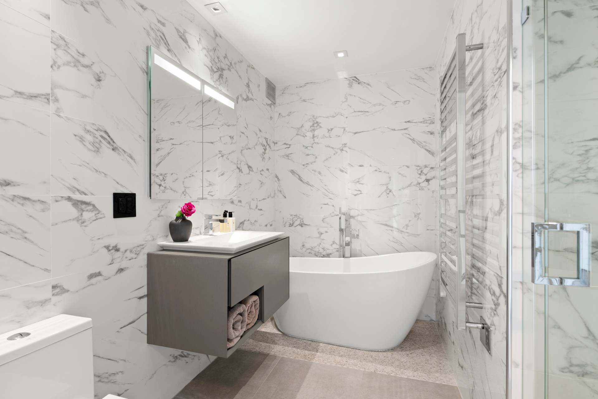 22 West 15th Street, Unit 19D Manhattan, NY 10011 - Photo 9 of 18 a bathroom with a bathtub and sink