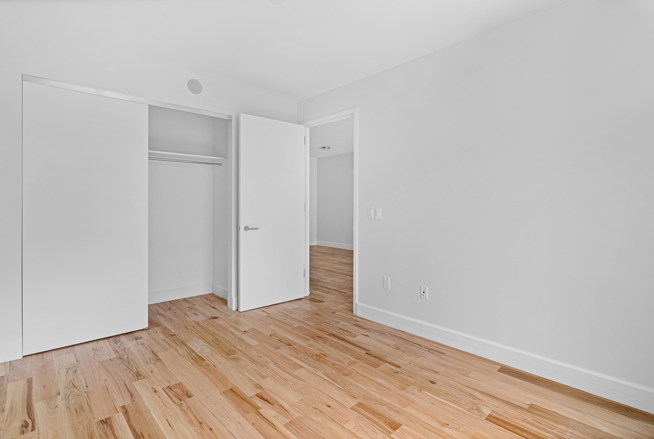 1098 Madison Street, Unit 4B Brooklyn, NY 11221 - Photo 8 of 11 a view of empty room with wooden floor