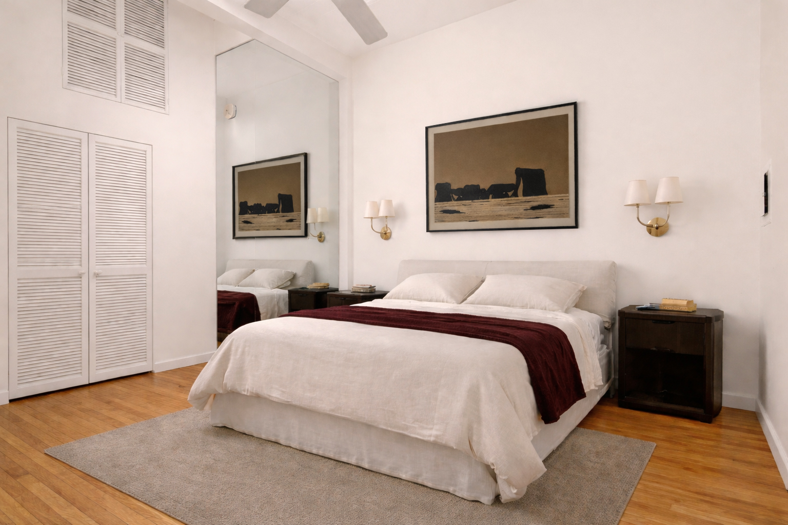 161 West 15th Street, Unit 2D Manhattan, NY 10011 - Photo 2 of 10 a bedroom with a bed and a couch