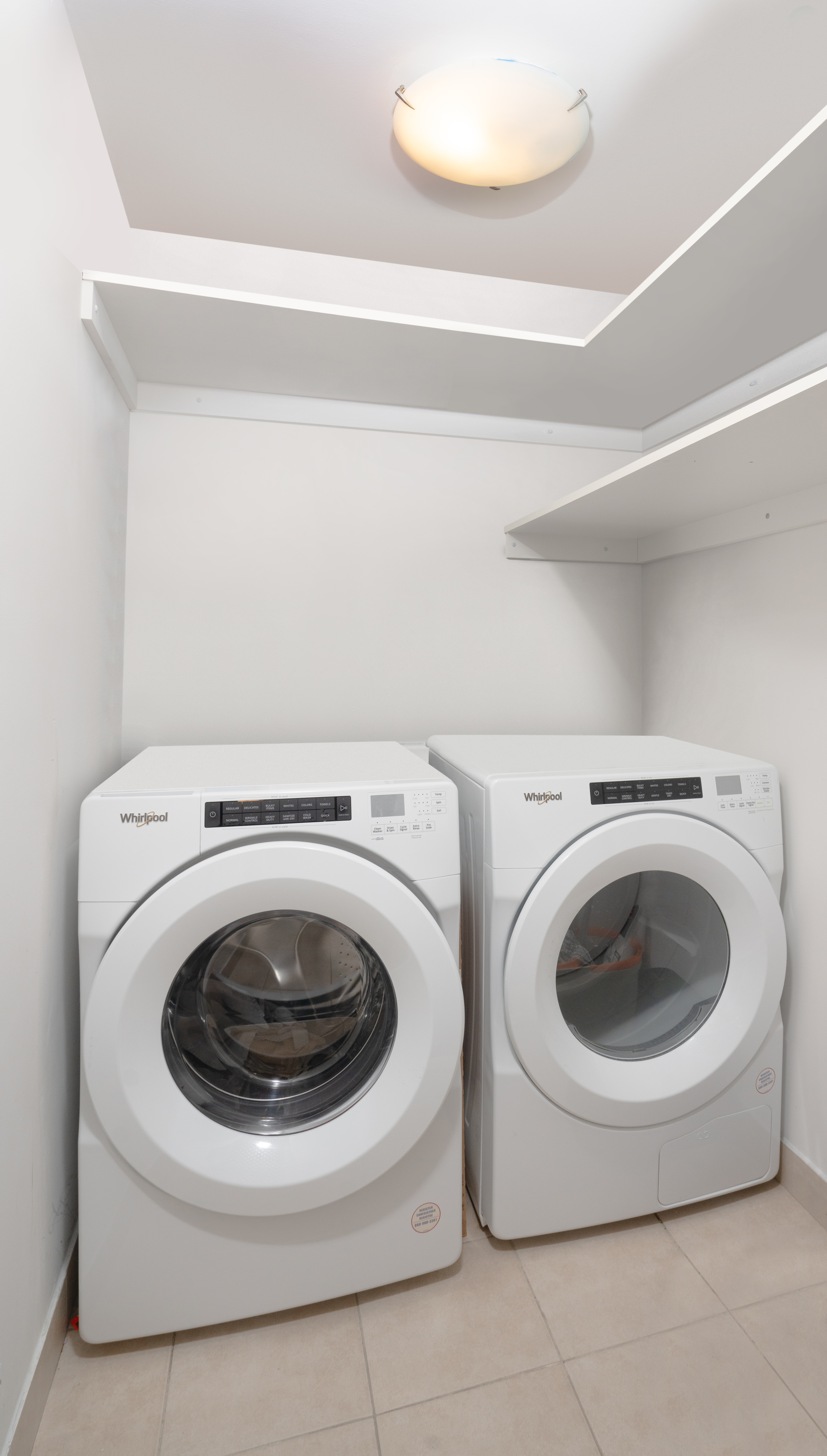 301 West 118th Street, Unit 8A Manhattan, NY 10026 - Photo 7 of 15 a utility room with dryer and washer