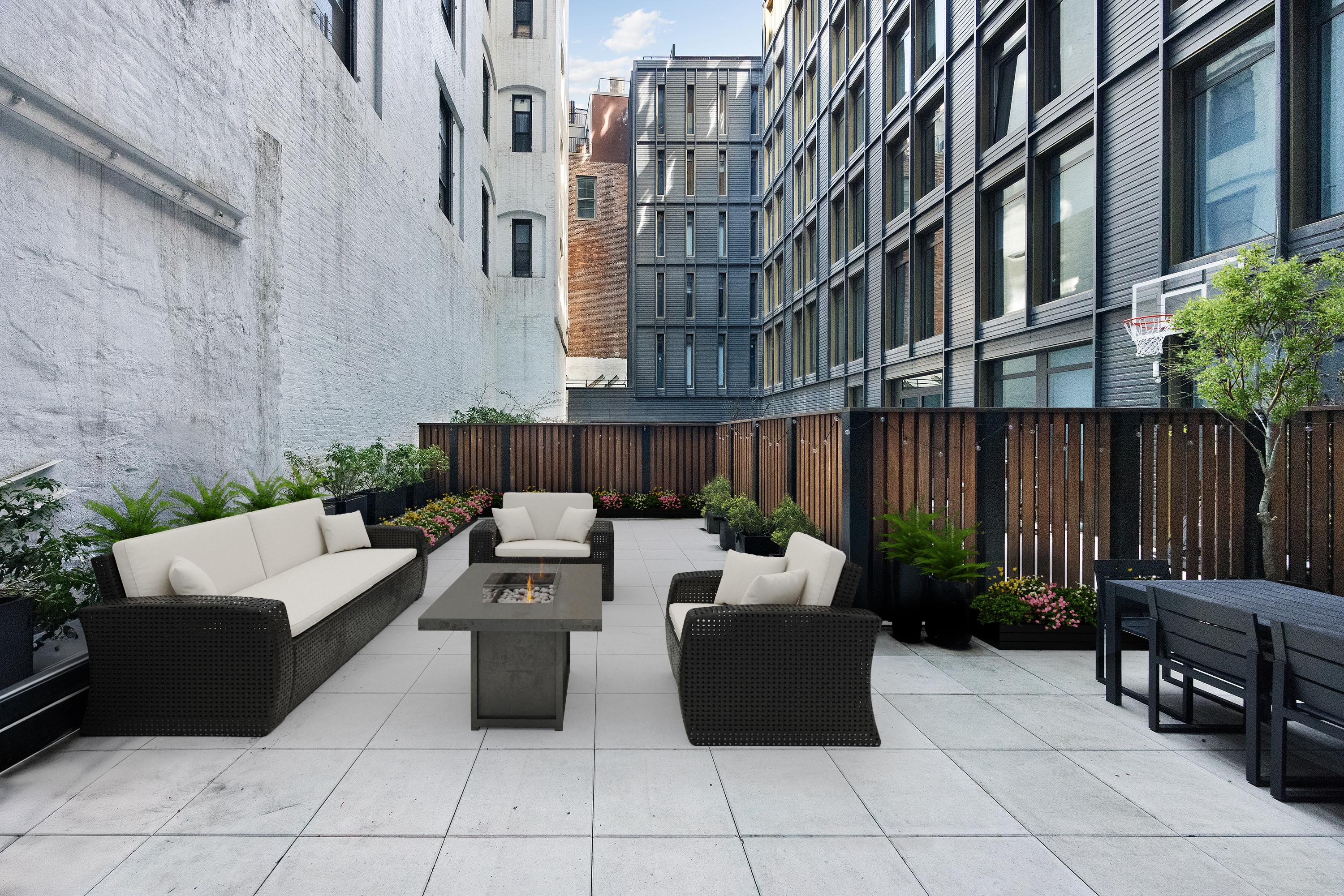 91 Leonard Street, Unit 2C Manhattan, NY 10013 - Photo 3 of 23 a view of a patio with couches table and chairs and potted plants