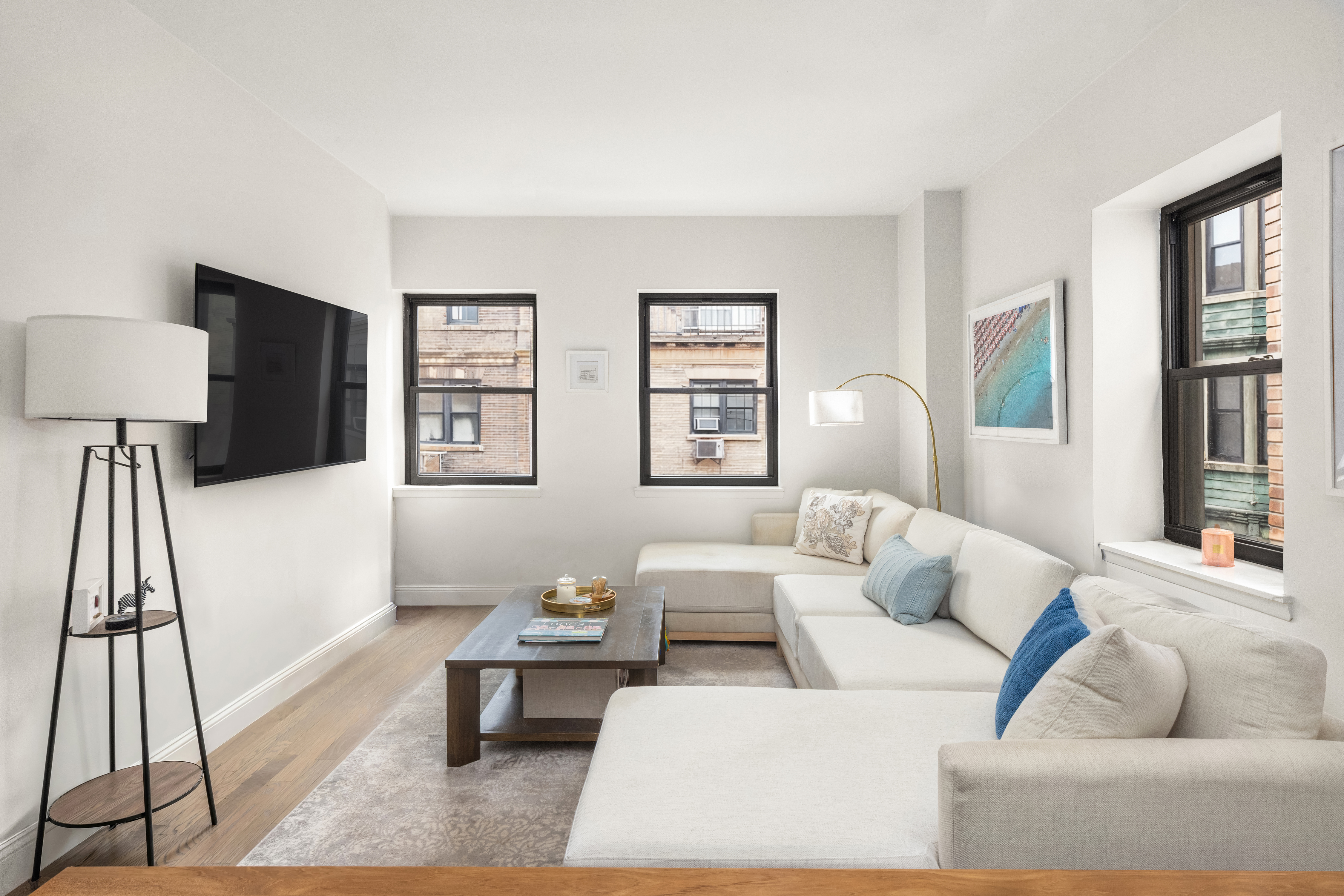 a living room with furniture and a flat screen tv