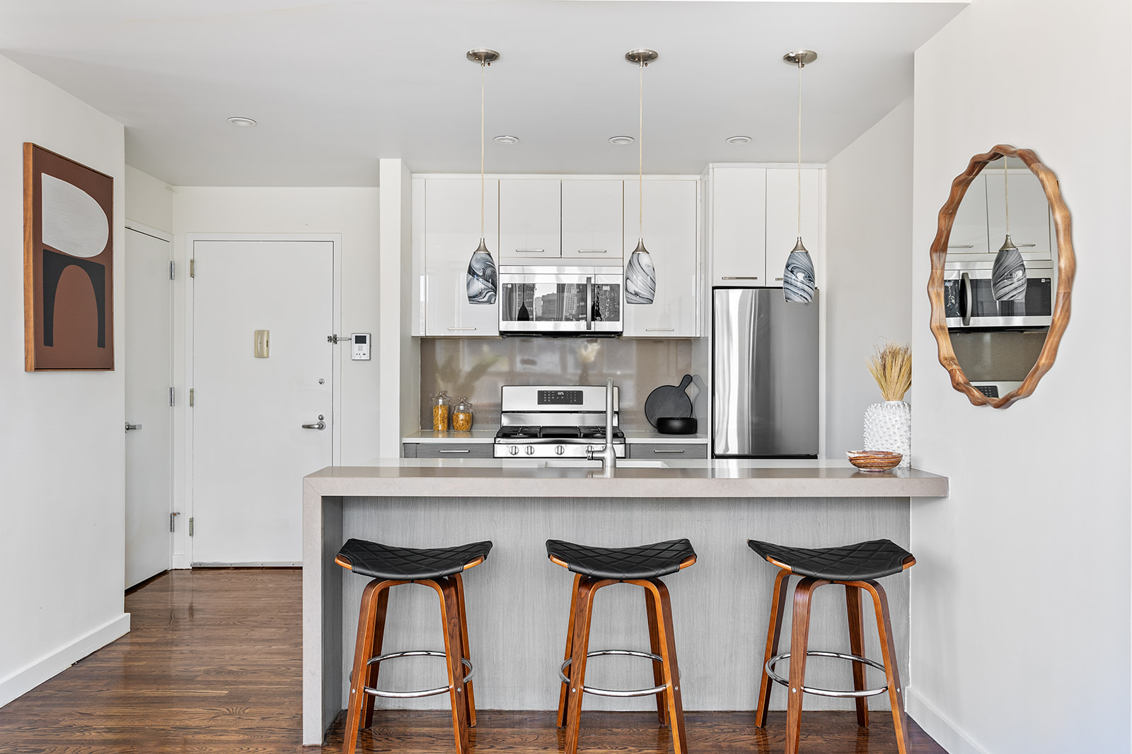 333 East 109th Street, Unit 7A Manhattan, NY 10029 - Photo 3 of 10 a kitchen with stainless steel appliances granite countertop a table and chairs in it
