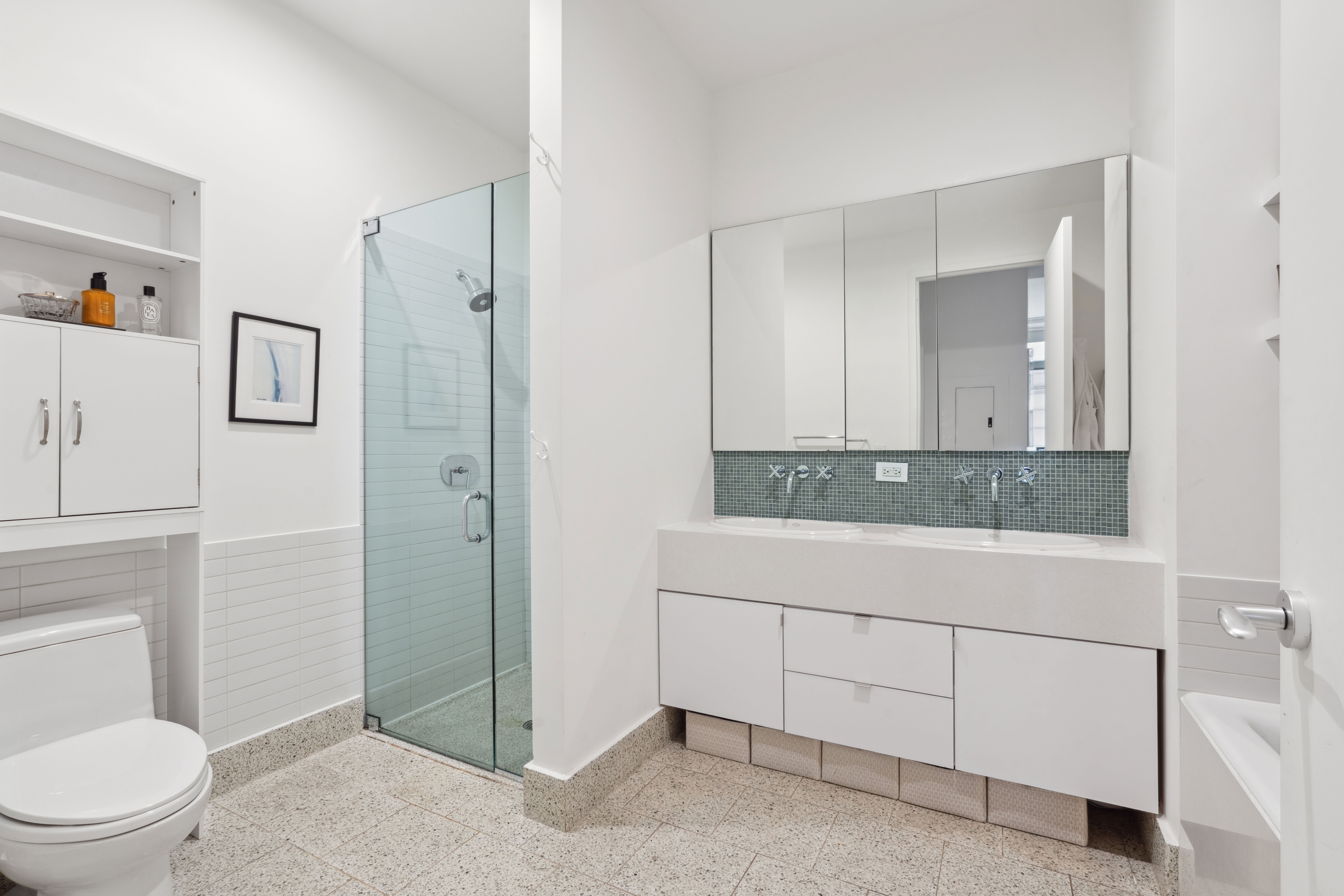 129 Lafayette Street, Unit 3B Manhattan, NY 10013 - Photo 11 of 13 a bathroom with a sink a toilet and shower