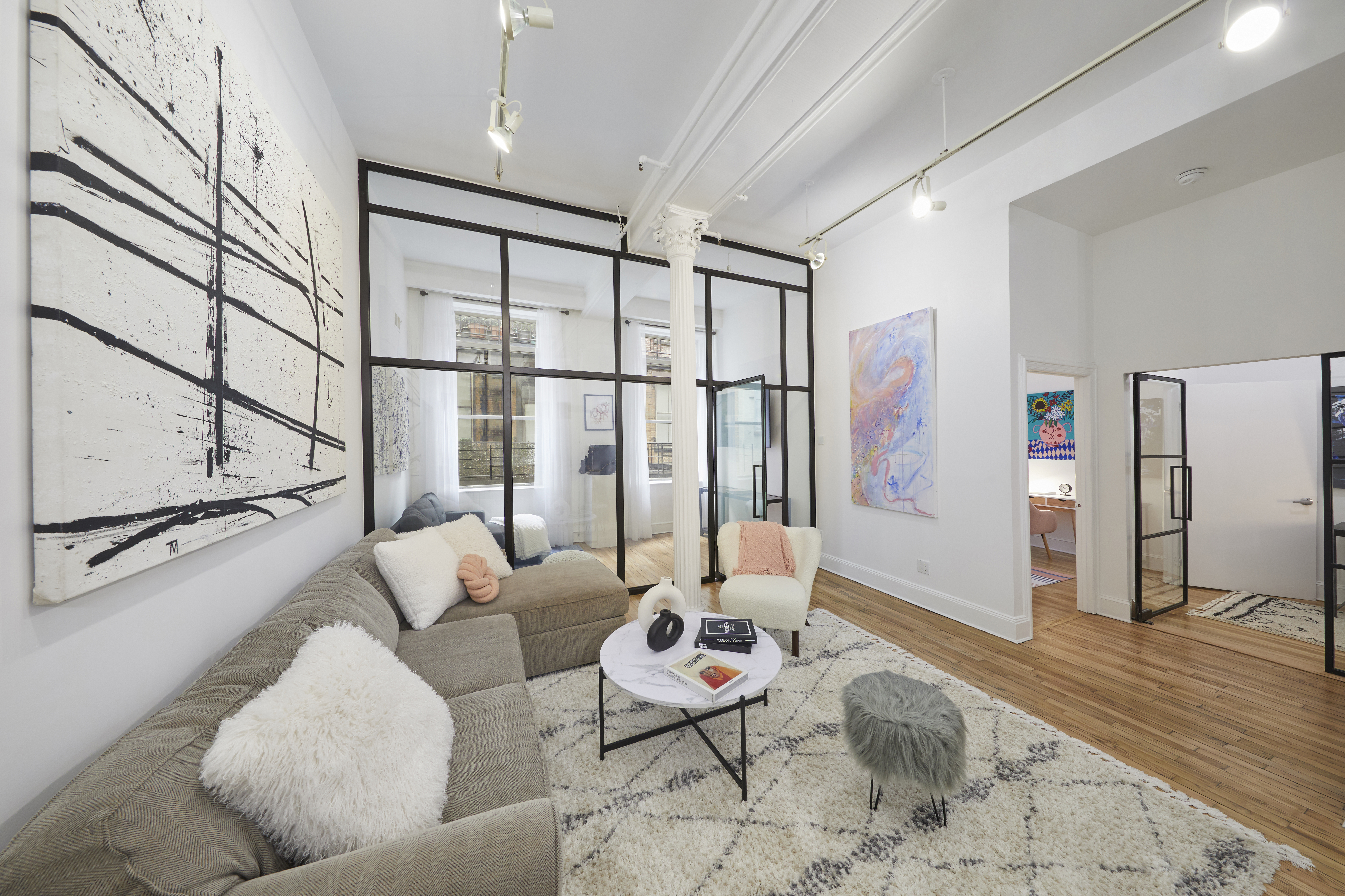 80 Leonard Street, Unit 3G Manhattan, NY 10013 - Photo 8 of 30 a living room with furniture and a window