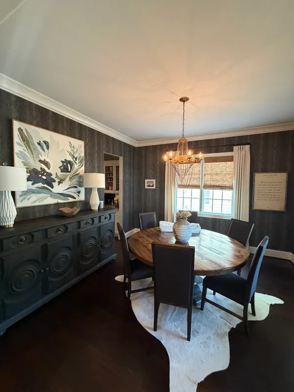 a dining room with furniture and window