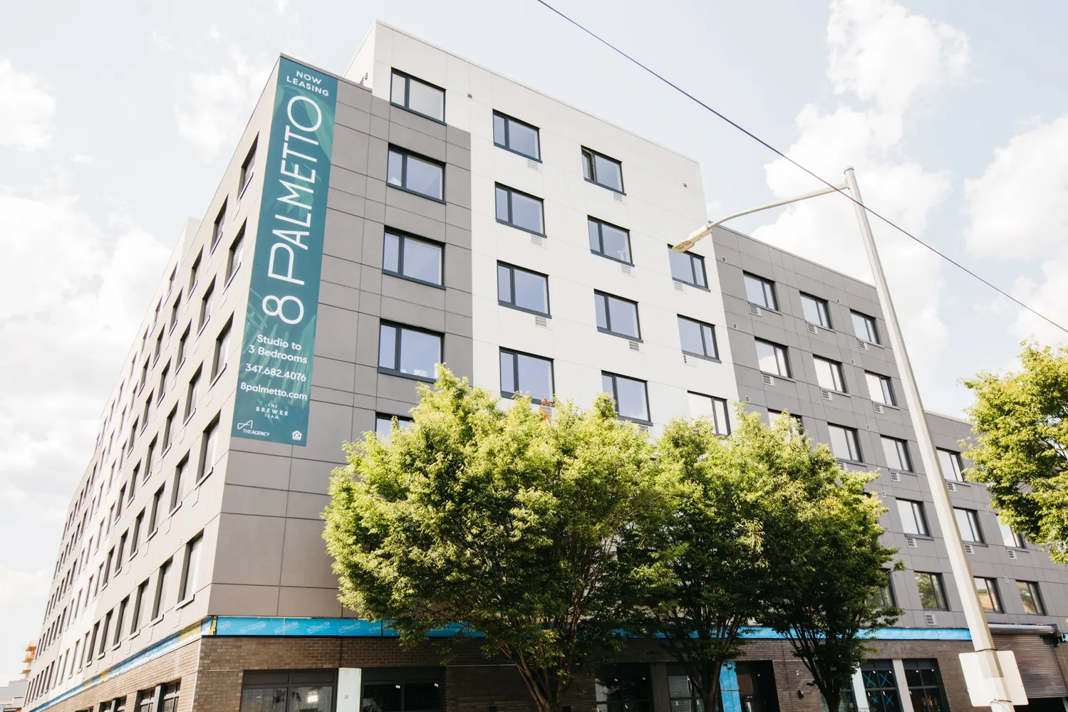 a picture of a book and a white bed