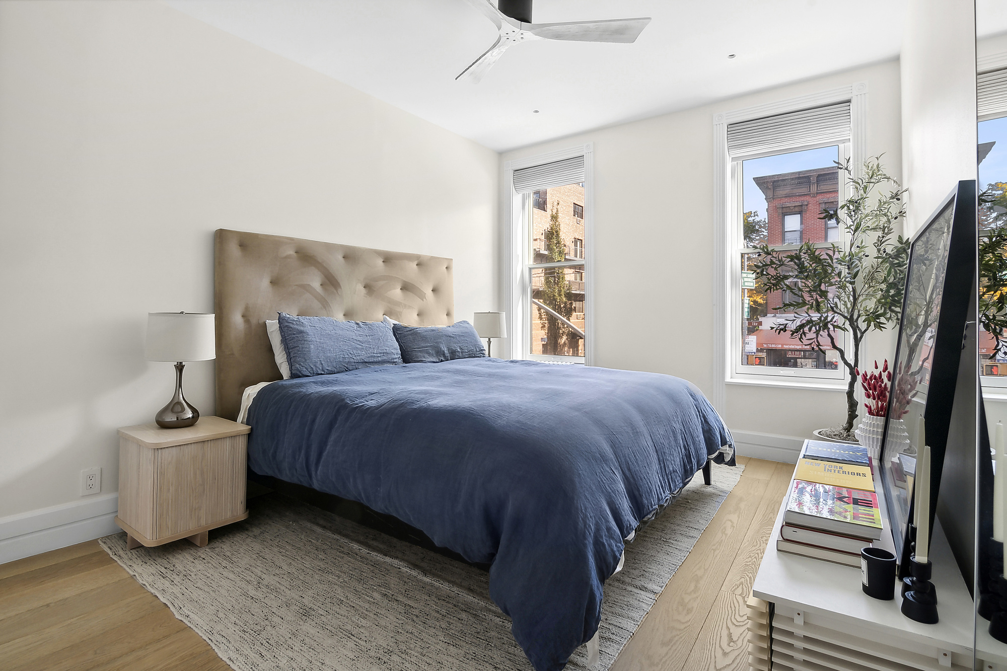 374 14th Street Brooklyn, NY 11215 - Photo 8 of 11 a bedroom with a bed and a potted plant