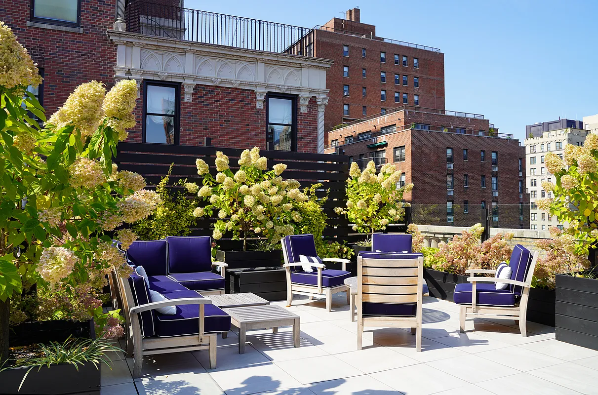 130 East 94th Street, Unit 1A Manhattan, NY 10128 - Photo 7 of 11 a building outdoor space with patio furniture and potted plants