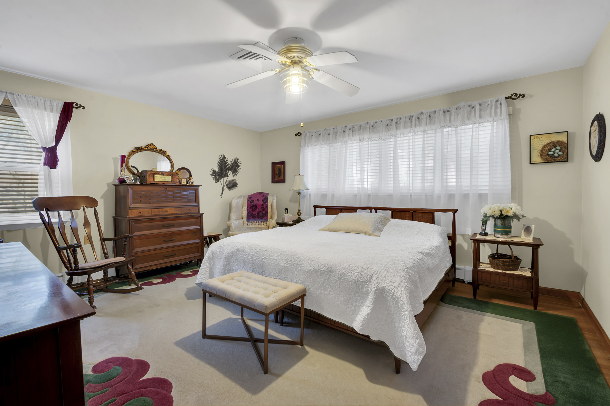 131 Jansen Street Staten Island, NY 10312 - Photo 8 of 21 a bedroom with a bed a chandelier and a dresser