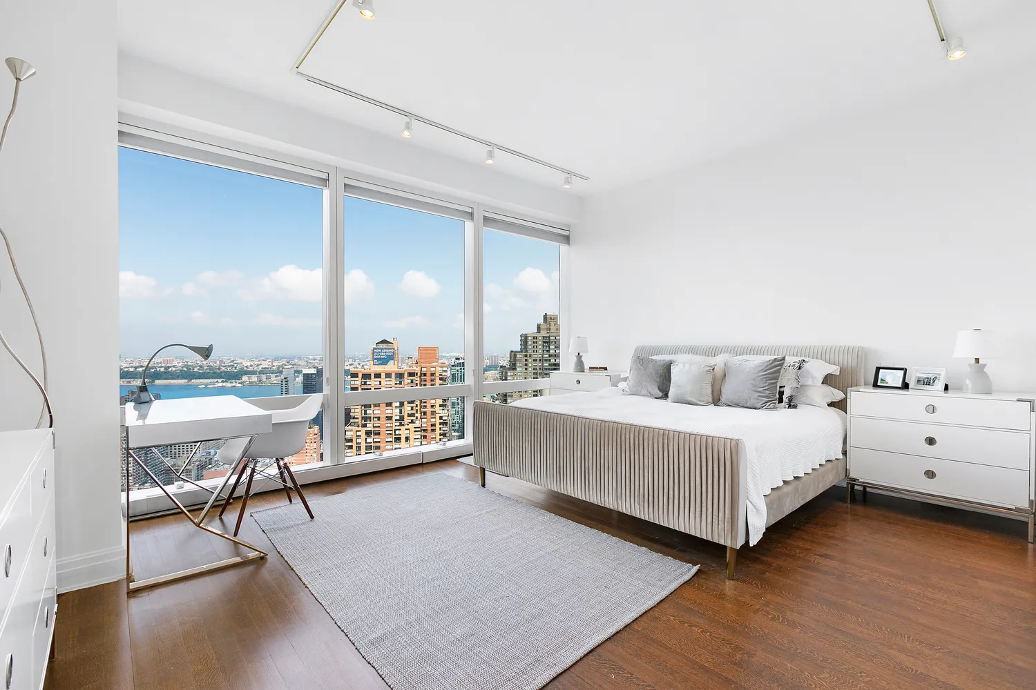 a living room with furniture and a large mirror