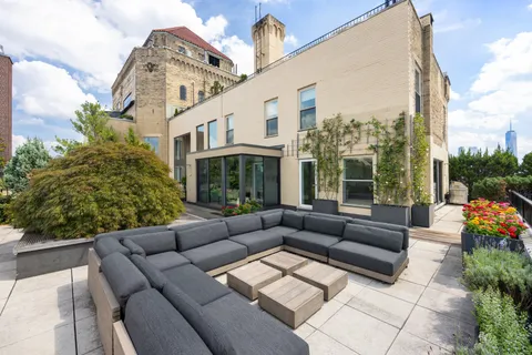 a view of living room filled with furniture and garden view