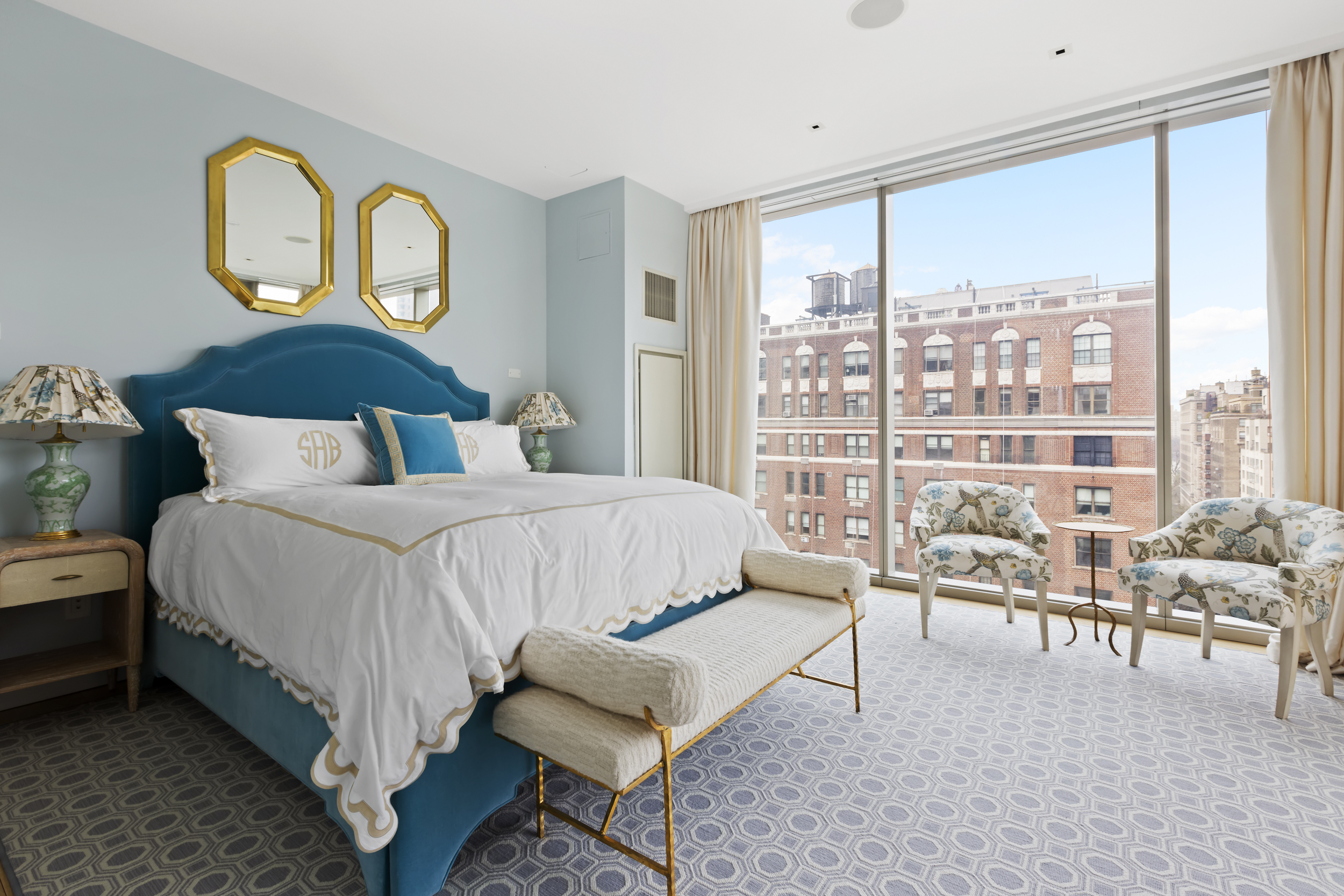 1055 Park Avenue, Unit PH Manhattan, NY 10028 - Photo 10 of 19 a bedroom with furniture and a large window