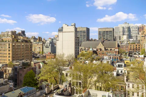 a view of city with tall buildings