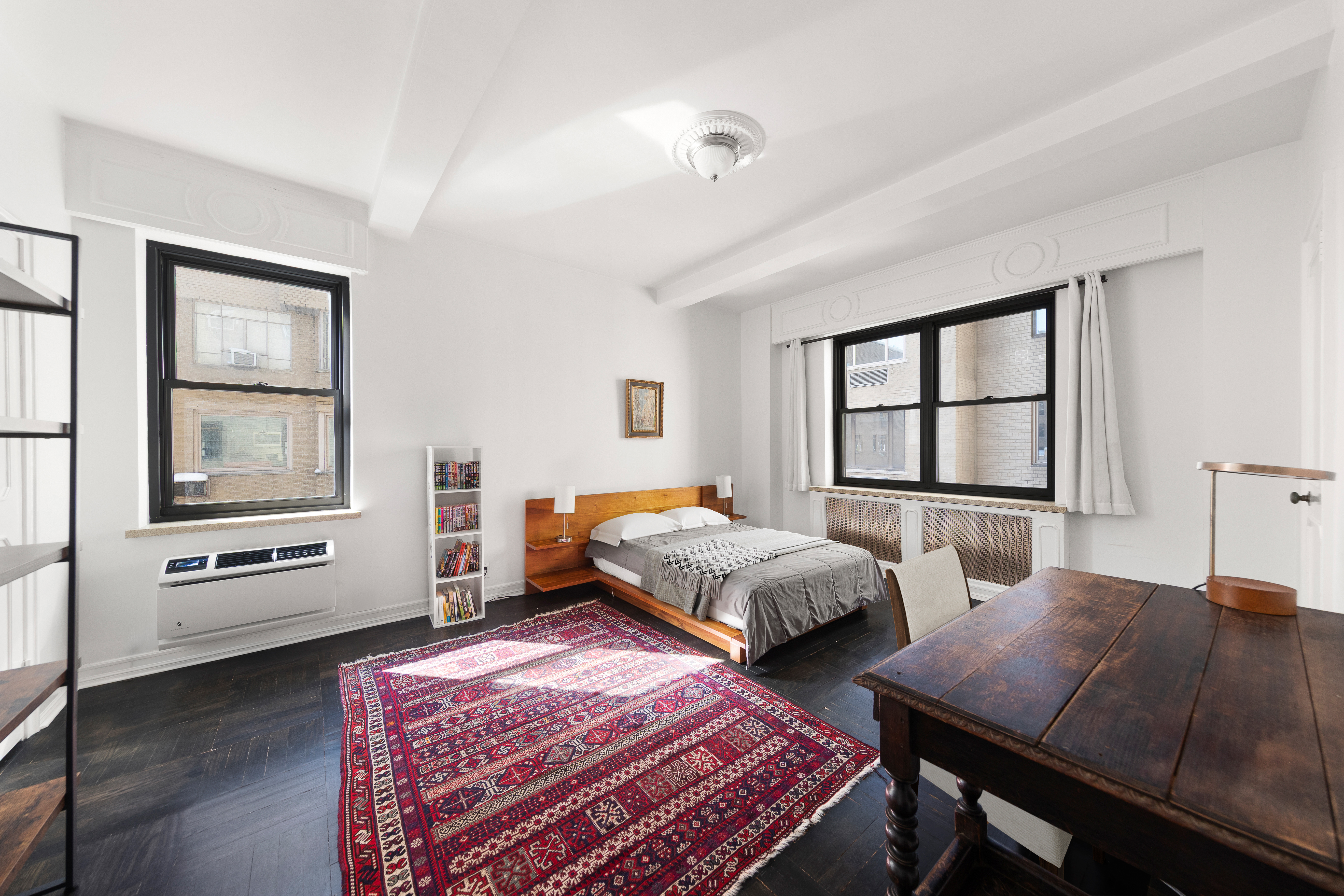 875 5th Avenue, Unit 9GH Manhattan, NY 10065 - Photo 8 of 13 a bedroom with two beds and a window