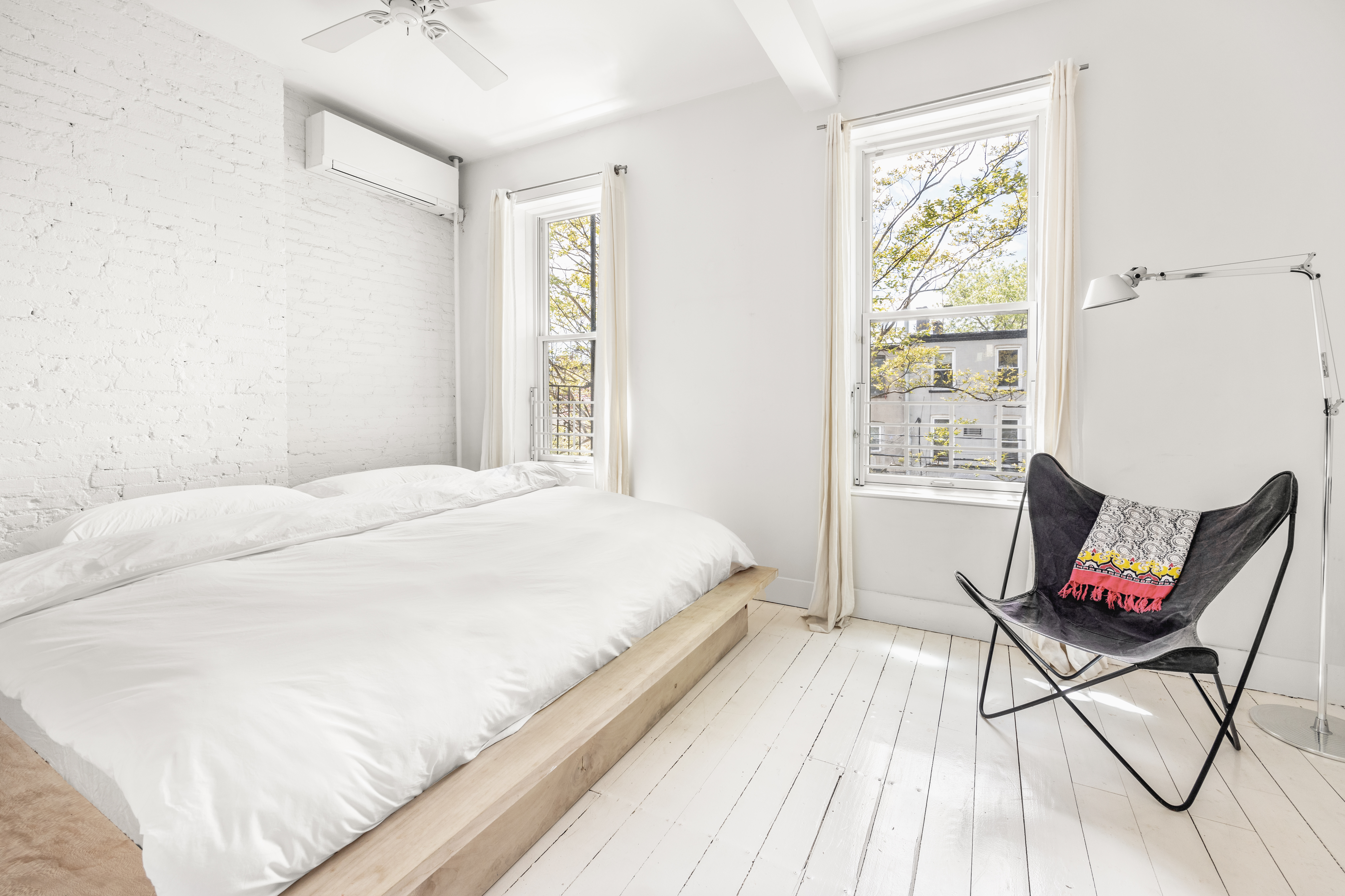 26 A 1st Street Brooklyn, NY 11231 - Photo 10 of 20 a bedroom with a bed a chair and next to a window