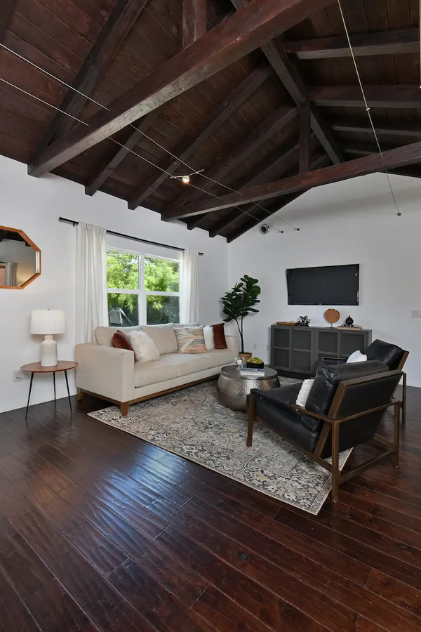 a living room with furniture and a large window