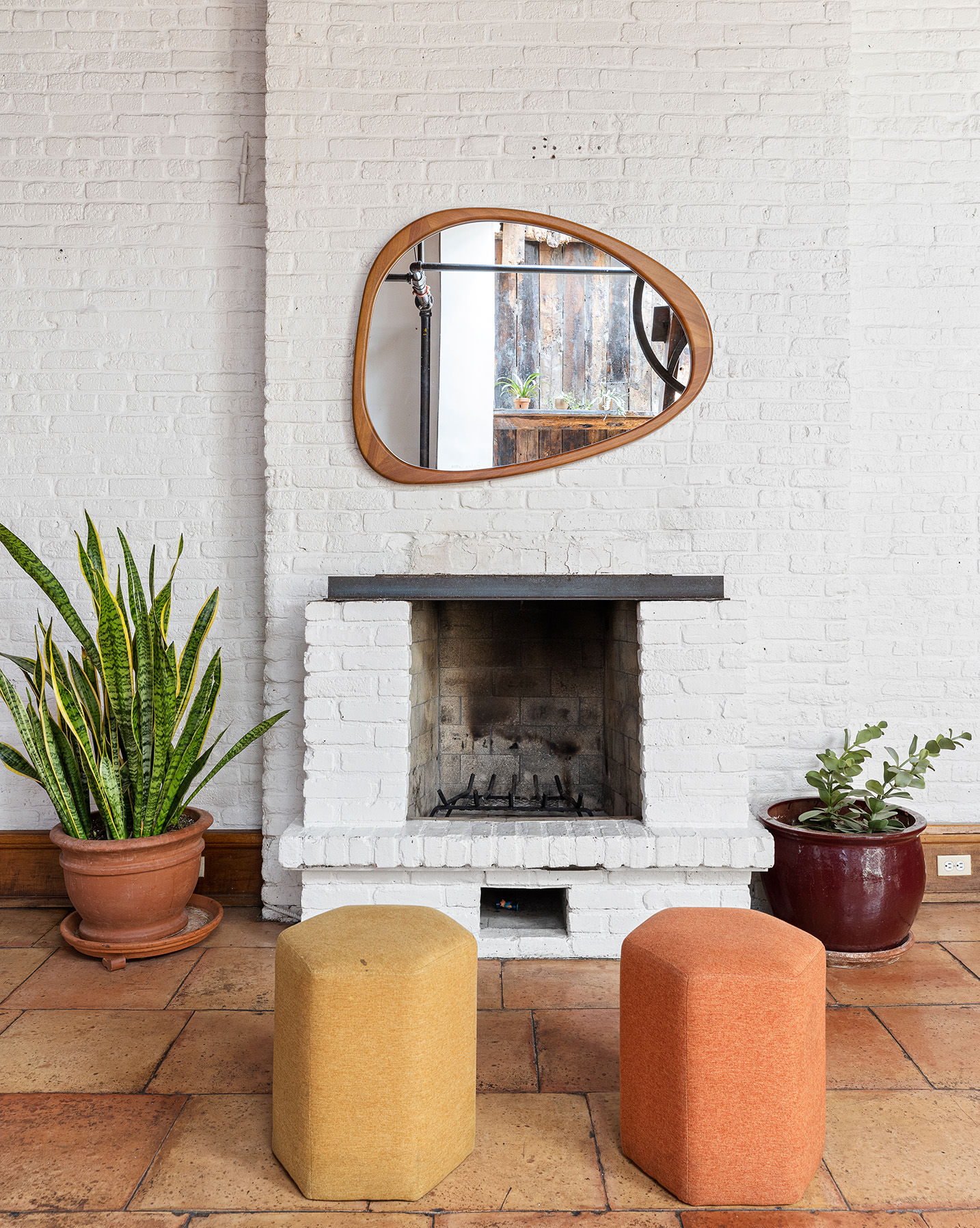 170 Eldridge Street Manhattan, NY 10002 - Photo 15 of 19 a living room with furniture potted plant and a fireplace