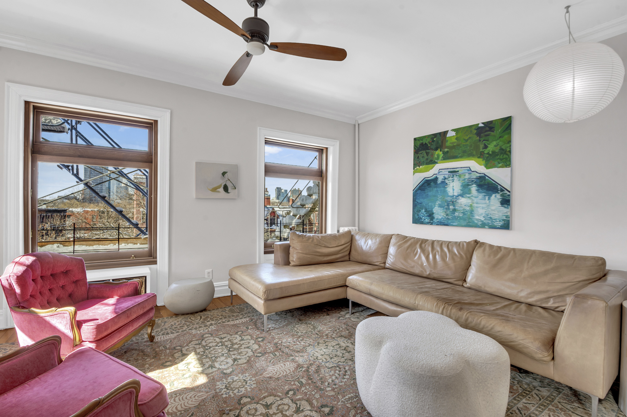 275 Clinton Avenue, Unit 4-1 Brooklyn, NY 11205 - Photo 2 of 20 a living room with furniture and a large window