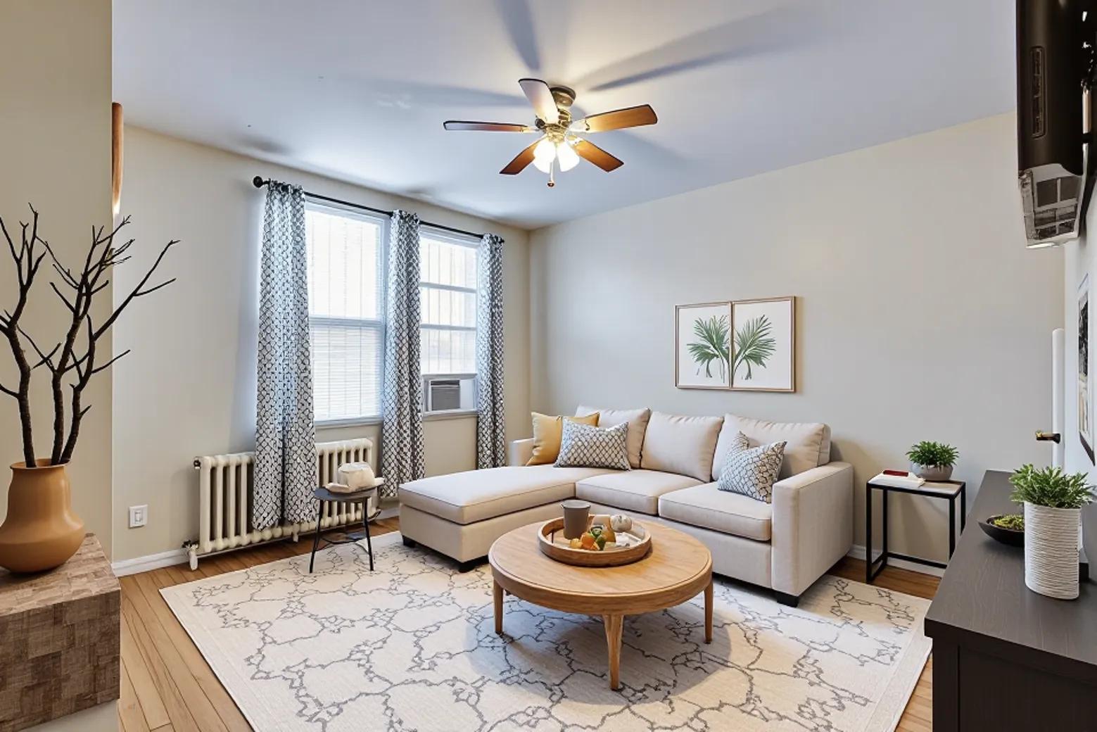 928 19th Street Northeast Washington, DC 20002 - Photo 4 of 13 a living room with furniture a rug and a chandelier