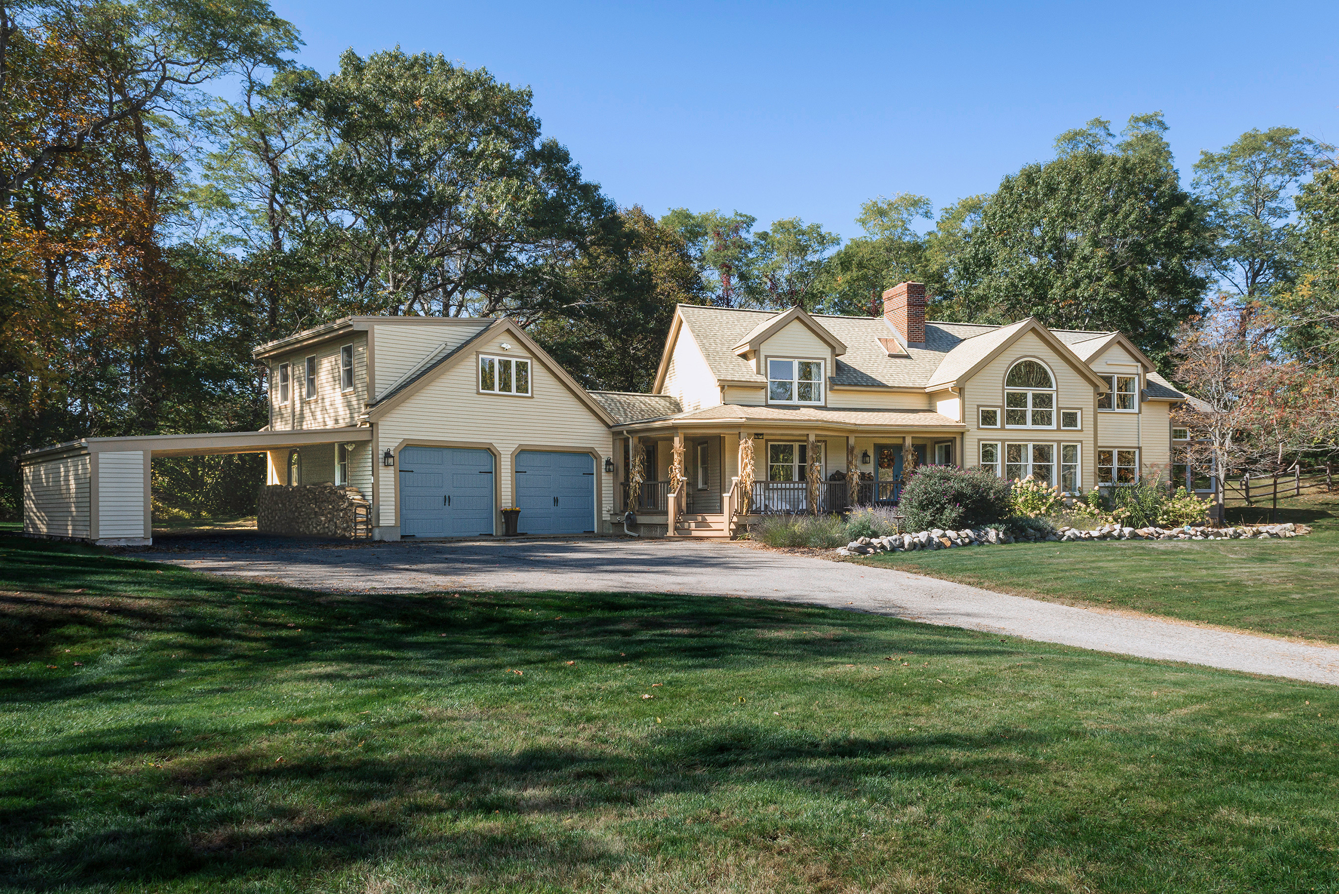 a front view of house with yard and green space