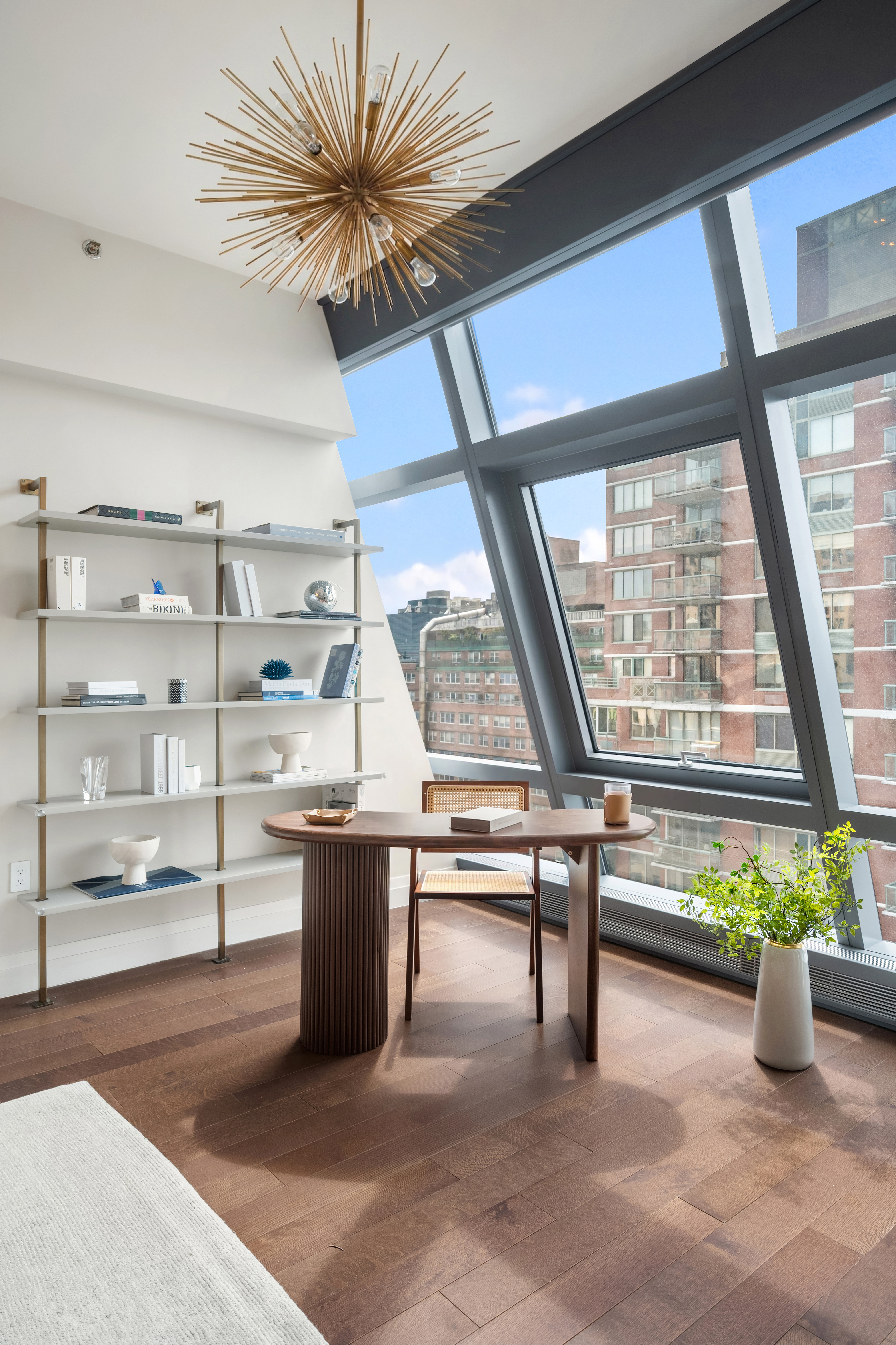 35 West 15th Street, Unit 14D Manhattan, NY 10011 - Photo 3 of 20 a view of workspace with wooden floor and windows