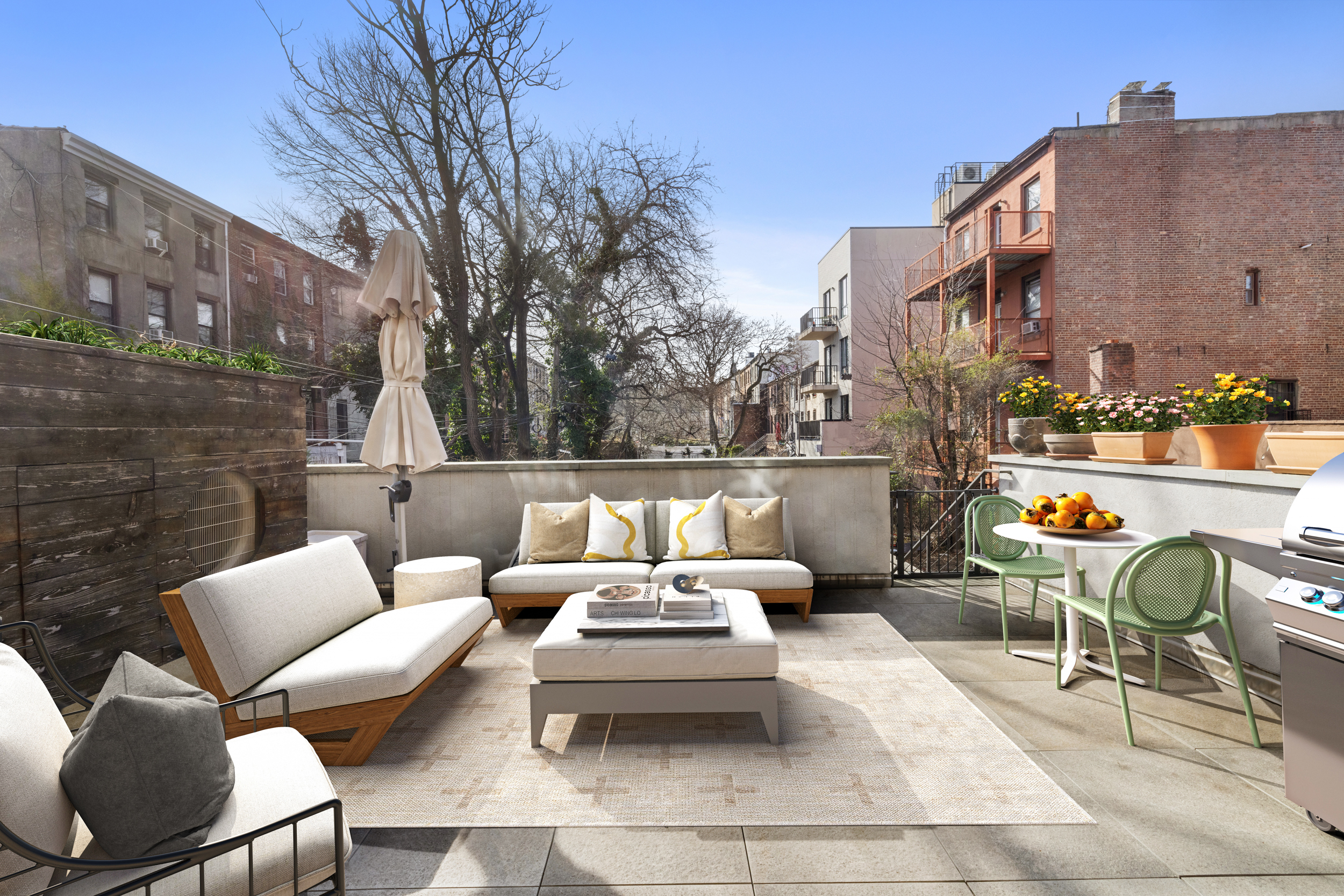 252 Stuyvesant Brooklyn, NY 11221 - Photo 4 of 18 a roof deck with couches and potted plants