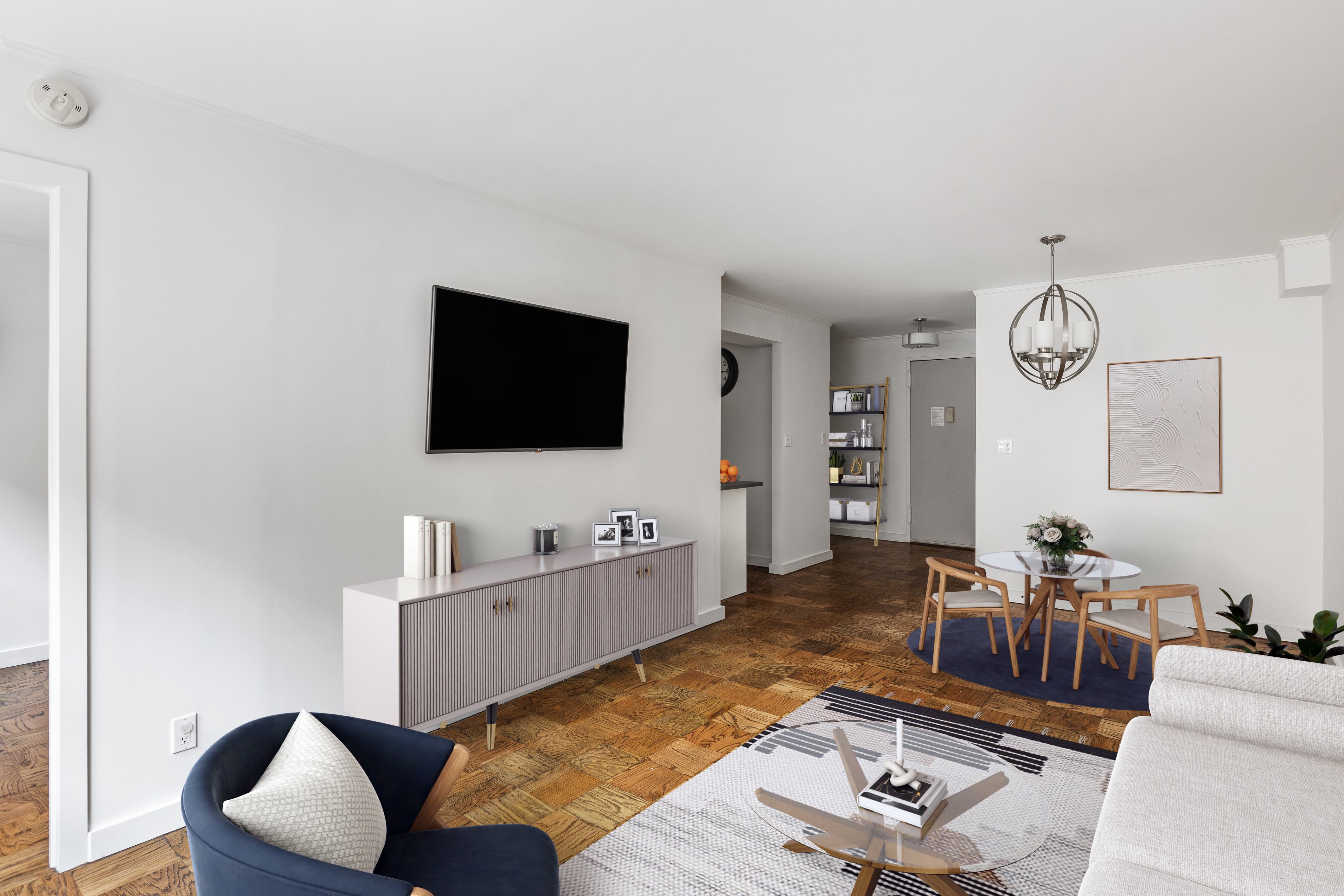 333 East 79th Street, Unit 4R Manhattan, NY 10075 - Photo 2 of 7 a living room with furniture and a flat screen tv