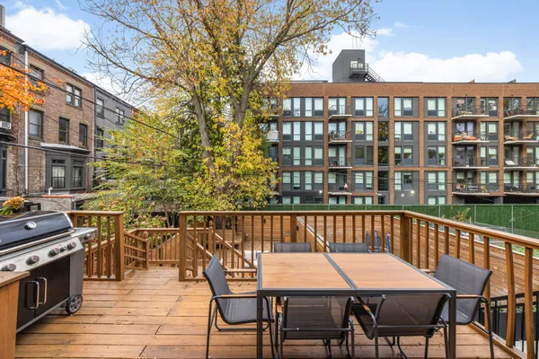 a view of a chairs and table on the deck