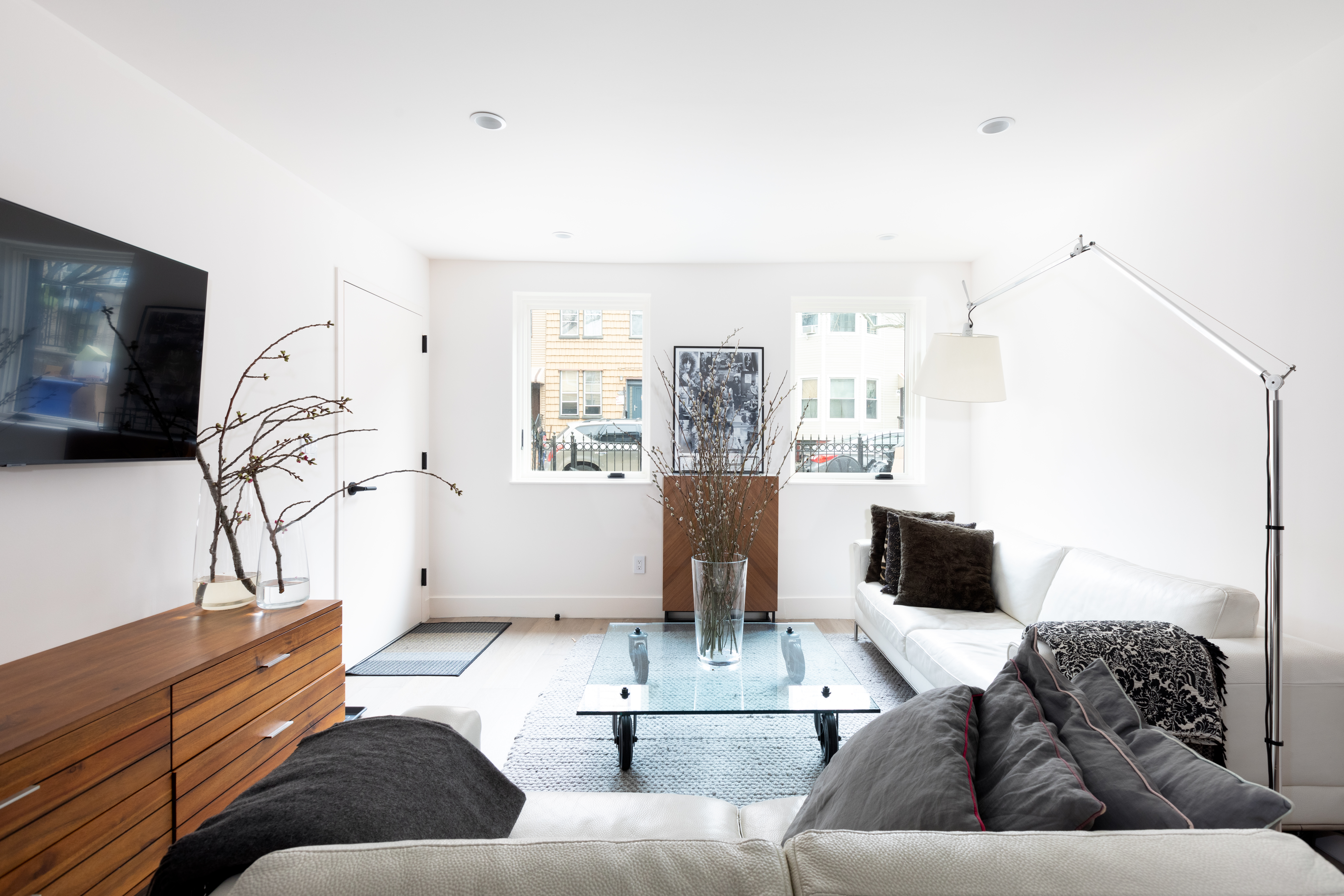 651 Leonard Street, Unit 1A Brooklyn, NY 11222 - Photo 1 of 12 a living room with furniture and a flat screen tv