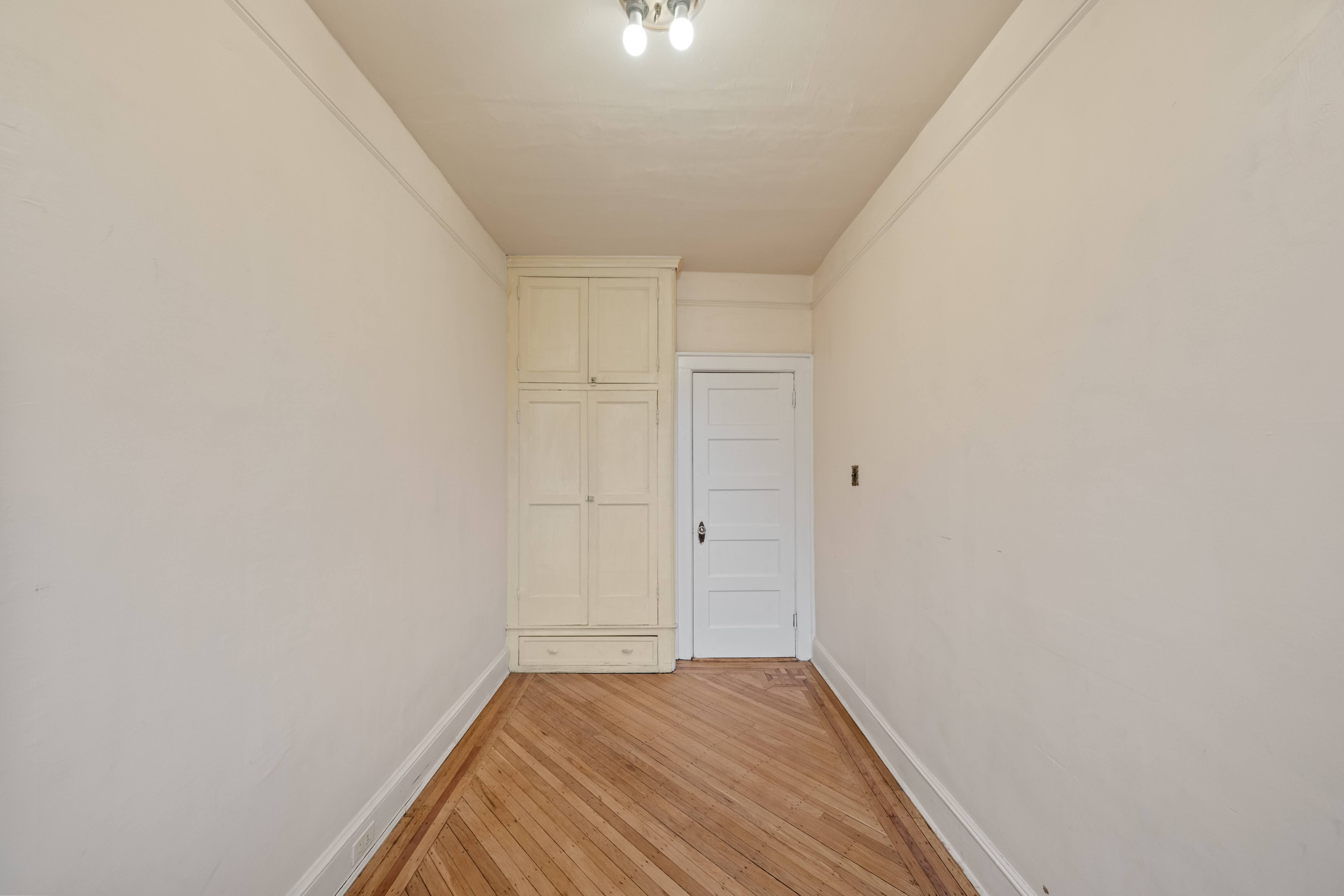 196 Maple Street Brooklyn, NY 11225 - Photo 17 of 31 a view of a room with wooden floor