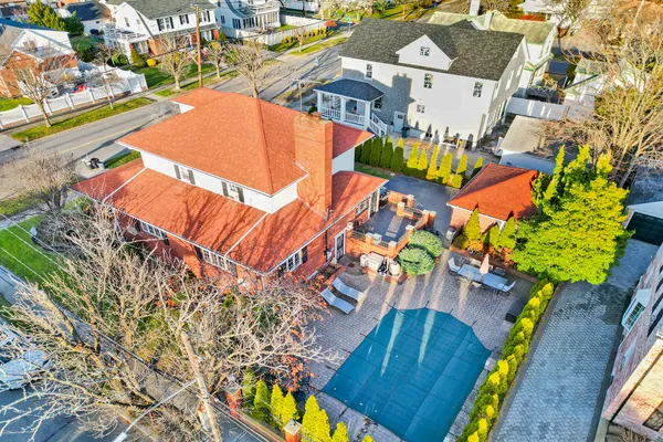 an aerial view of a house with a swimming pool